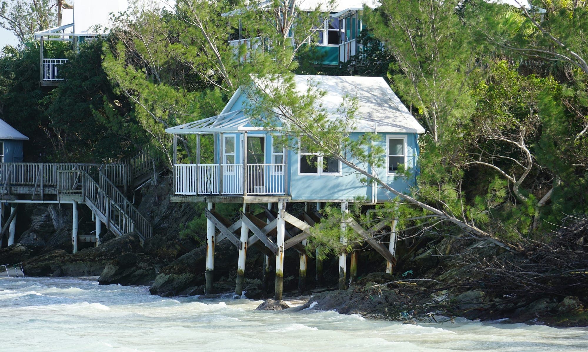 Raised house on piles at the water's edge