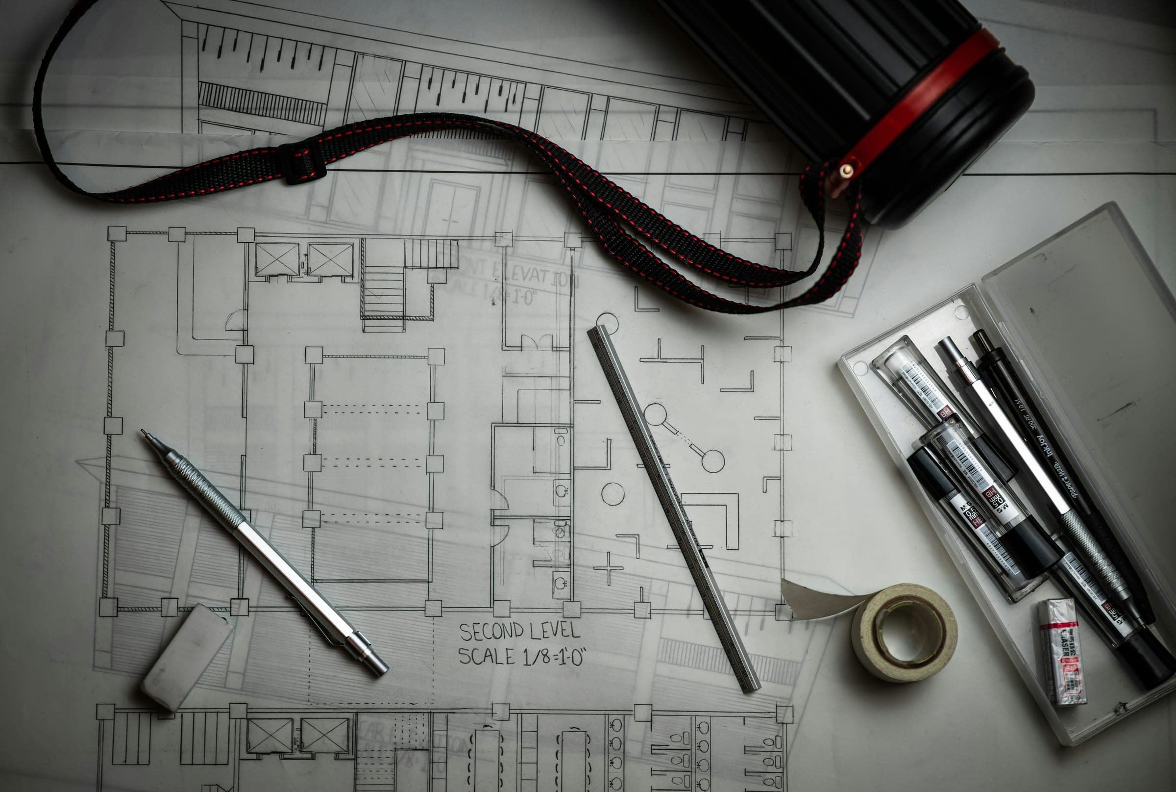 Floor plan sketch with drafting pens