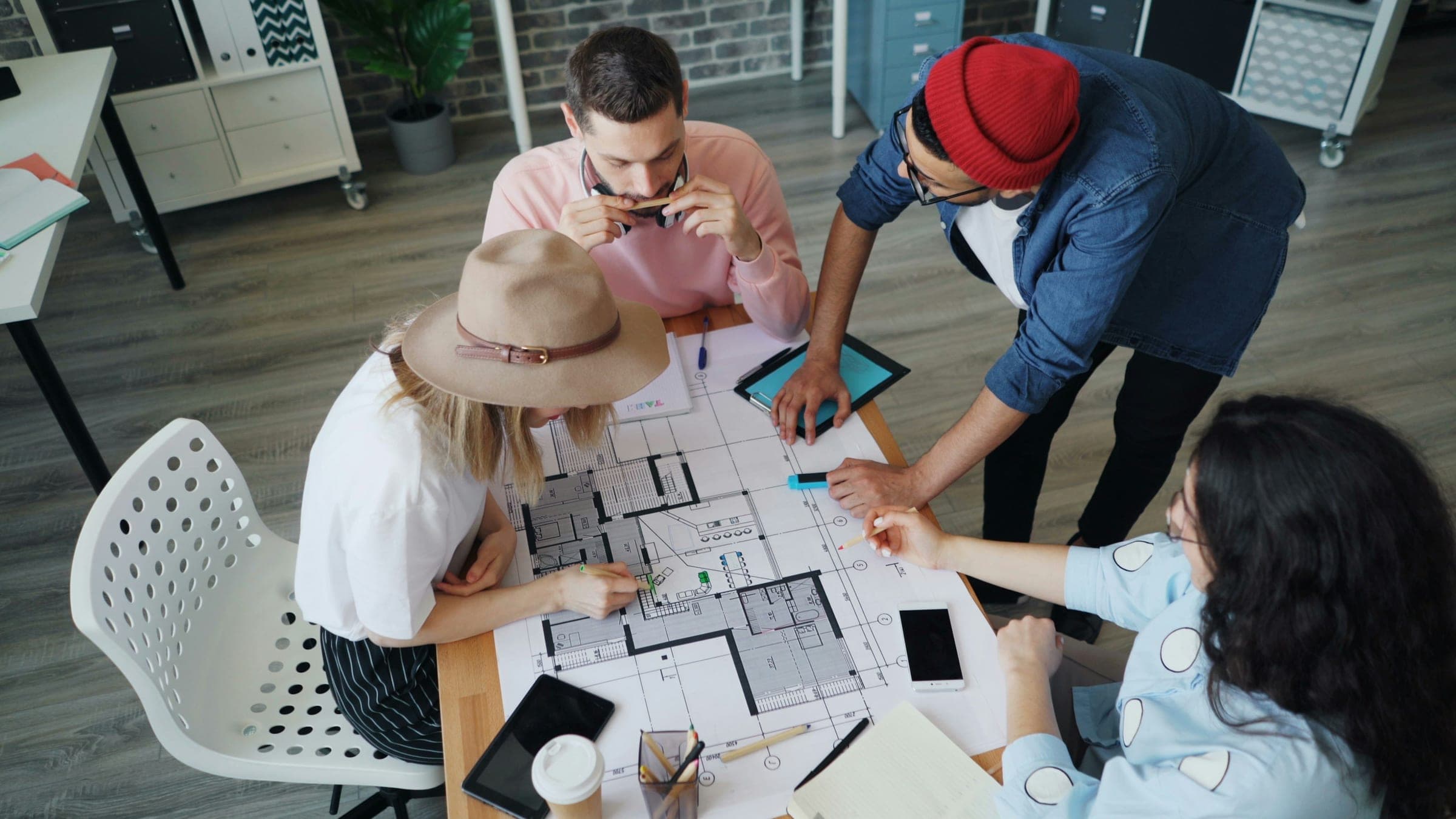 Team reviewing floor plans
